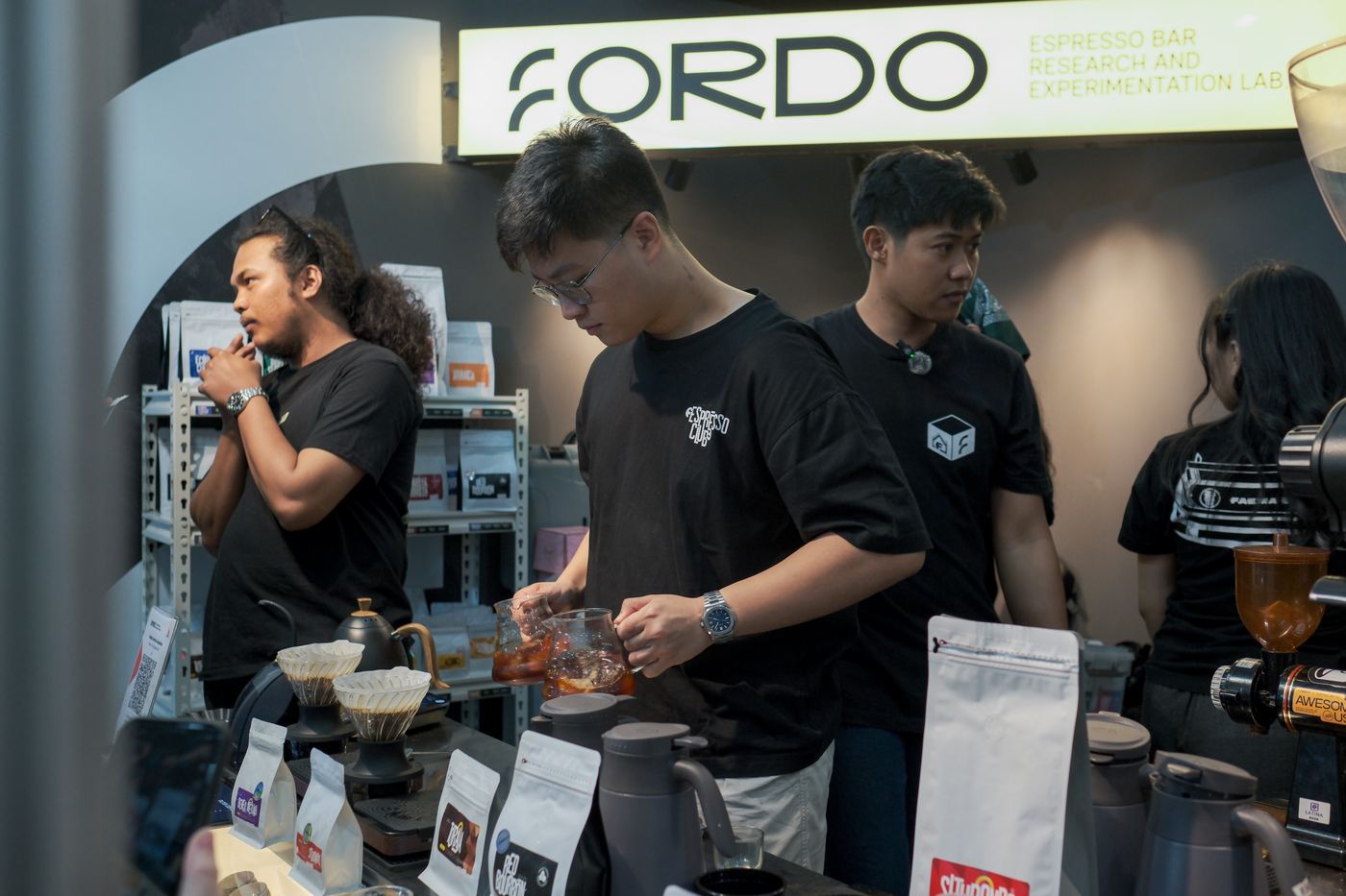 Fordo brew bar with a shelf of retail coffee bags